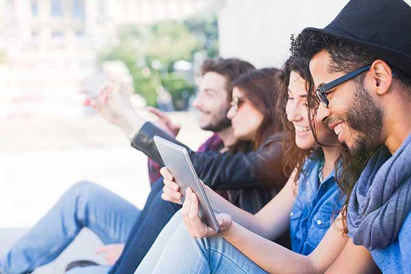 Group of people looking at tablets