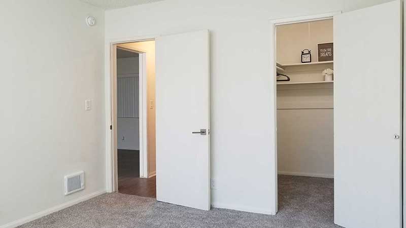 Bedroom and closet interior photo of Bleu Apartments