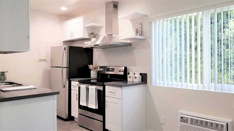 Kitchen with window interior photo of Bleu Apartments