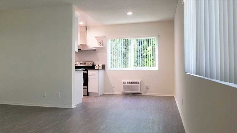 Living room and dining area interior photo of Bleu Apartments